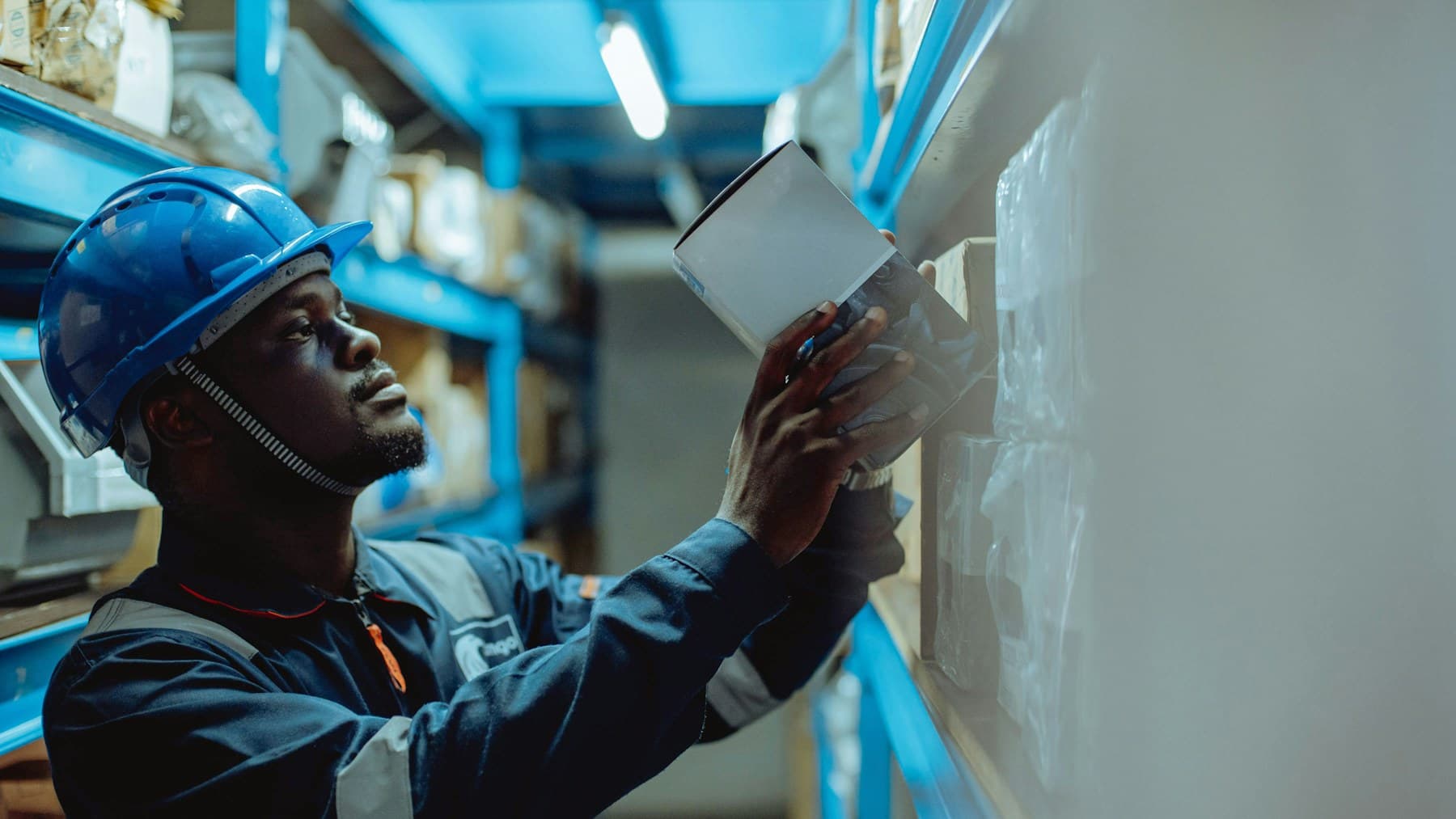Warehouse worker scanning supplier inventory during receiving